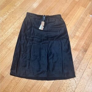 Skims silk above the knee skirt.